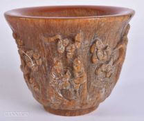 A CHINESE HORN TYPE LIBATION CUP. 8.5 cm wide.