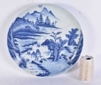 A LARGE CHINESE QING DYNASTY BLUE AND WHITE PORCELAIN DISH painted with a scholar in a landscape.