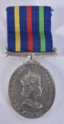 A BOXED MEDAL.
