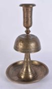 AN 18TH CENTURY PERSIAN MIDDLE EASTERN BRONZE CANDLESTICK engraved with figures and landscapes. 21
