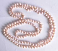 A Pink Pearlescent Bead Necklace. 128cm long, weight 83g