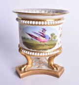 Early 19th century Flight Barr and Barr vase with three lion’s feet, painted with a bird in