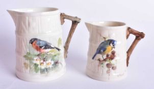 Royal Worcester barrel shaped jug painted with a Bullfinch and another smaller painted with a