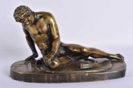 A 19TH CENTURY GRAND TOUR BRONZE FIGURE OF THE DYING GAUL modelled upon an oval base. 24.5 cm wide.