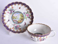 Worcester teacup and saucer painted with a landscape to each, the ground painted with flowers,