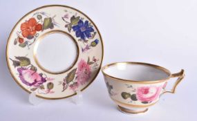 Early 19th century Flight Barr and Barr cup and saucer painted with large flowers on a pale yellow