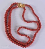 A 18CT CLASP STRING CORAL BEAD NECKLACE. 170 grams. 63 cm.