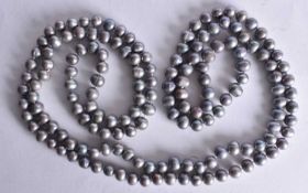 A HARD STONE Grey Pearlescent Bead Necklace. 120cm long, weight 88g