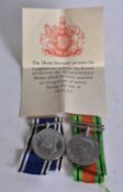 A DEFENCE & POLICE MEDAL presented to Inspr Harry S Kelsey. (2)