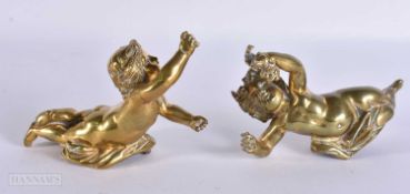 A PAIR OF 19TH CENTURY BRONZE PUTTI. 15 cm wide.