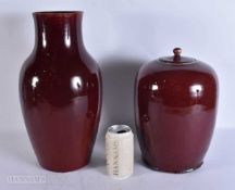 A LARGE 19TH CENTURY CHINESE SANG DU BOEUF PORCELAIN VASE together with a jar and cover. Largest