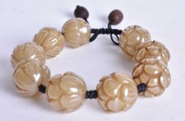 A HARD STONE Carved Bead Bracelet. 24cm long