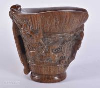 A CHINESE HORN TYPE LIBATION CUP. 14 cm x 12 cm.