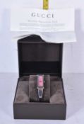 A Gucci 1500 L ladies wrist watch with original box, face, 2.5 cm x 1 cm