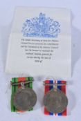 TWO BOXED MEDALS. (2)
