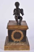 A MID 19TH CENTURY FRENCH BRONZE INKWELL AND COVER formed with a seated putti upon a classical base.