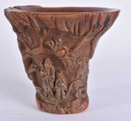 A CHINESE HORN TYPE LIBATION CUP. 12 cm x 15 cm.