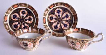 Royal Crown Derby pair of cups and saucer painted with imari pattern 1128, date mark 1916. 6 cm x 12