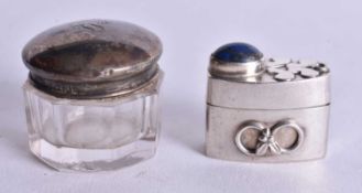 A Silver Topped Glass Cosmetic Jar together with a Silver Pill Box set with a Lapis Cabochon.