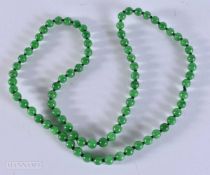 A STRING BEAD JADE NECKLACE. 64 grams. 72 cm.