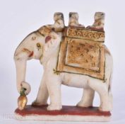 A 19TH CENTURY INDIAN RAJASTHANI PAINTED MARBLE FIGURE OF AN ELEPHANT modelled with attendants. 14