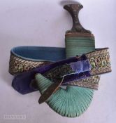 A EARLY TO MID 20TH CENTURY YEMENI JAMBIYA DAGGER WITH ACCOMPANIED BELT. WE ARE UNABLE TO OFFER IN-