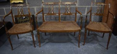 AN EDWARDIAN SATINWOOD SOFA AND MATCHING CHAIRS. (3) 87cm x 66 cm x 92cm