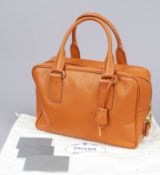Prada, Papaya Saffiano Leather Tote Bag, orange textured Saffiano leather, gold-tone hardware,