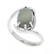 Opal ring in 585/000 white gold with an oval opal cabochon 10 x 7 mm, slightly grayish with good