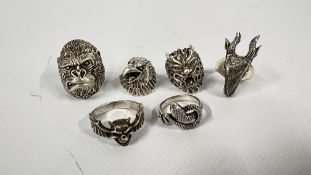 A GROUP OF SIX SILVER GOTHIC TYPE ANIMAL HEAD RINGS TO INCLUDE GORILLA, RAMS HEAD, EAGLE, BAT SKULL,