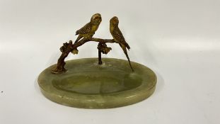 AN AUSTRIAN BRONZE AND COLD PAINTED MODEL OF TWO BUDGERIGARS ON A DISHED ONYX BASE A/F.