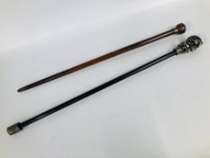 TWO FANTASY WALKING STICKS ONE WITH SKULL FINIAL, THE OTHER MOUNTED WITH CLOCK.
