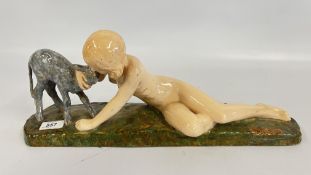 A FRENCH CERAMIC FIGURE OF RECLINING GIRL WITH LAMB SIGNED A.Y. BUTTER, LENGTH 49CM.