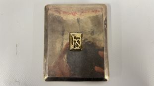 A VINTAGE SILVER CIGARETTE CASE WITH A RAISED APPLIED MONOGRAM PANEL 