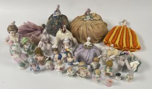 A GROUP OF VINTAGE PIN CUSHION DOLLS AND A COLLECTION OF VINTAGE PORCELAIN & BISQUE HALF DOLLS TO