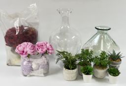 A GROUP OF POTTED FAUX PLANTS AND FLOWERS + A LARGE DESIGNER CLEAR GLASS VASE H 50CM AND ONE OTHER.