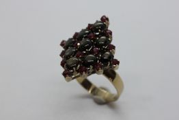 A RUBY AND SMOKEY CABACHON CLUSTER RING,