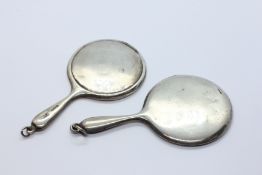 TWO MINIATURE SILVER MOUNTED CHANTELAINE HAND MIRRORS.