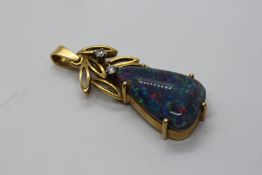 AN OPAL TRIPLET AND DIAMOND PENDANT, THE IRREGULAR TRIANGULAR OPAL TRIPLET APPROX 19MM X 12.