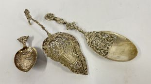 TWO ELABORATE CONTINENTAL WHITE METAL OPEN WORK SPOONS L 22.5CM & 20CM + ONE OTHER EXAMPLE (CUT).