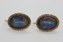 A PAIR OF OVAL OPAL TRIPLET EARRINGS APPROX 18MM X 13MM IN RUB OVER SETTING WITH TWISTED WIRE