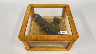 A MODEL MILITARY RAF PLANE MOUNTED IN A DISPLAY CASE 32 X 32 X H 15CM.