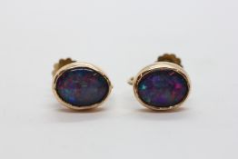 A PAIR OF OVAL OPAL TRIPLET EARRINGS APPROX 10MM X 8MM,
