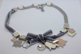 A BOXED CHRISTIAN DIOR DESIGNER NECKLACE.