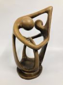 A LARGE SOAPSTONE FIGURE DEPICTING AN EMBRACE, H 36CM.