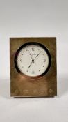 A SILVER MOUNTED MILLENIUM MANTEL CLOCK MARKED R.J. CARR - H 7 X W 6CM.