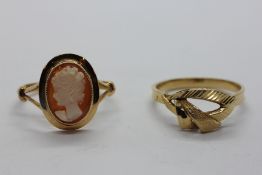 A CAMEO RING MARKED 750 ALONG WITH A CONTEMPORARY DESIGN YELLOW METAL RING WITH CONTINENTAL