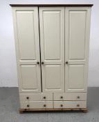 A MODERN CREAM FINISHED TRIPLE WARDROBE WITH 4 LOWER DRAWERS, W 129 X D 57 X H 185CM.