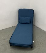 A MODERN BLUE LINEN CONVERTIBLE ARMCHAIR BED.
