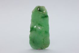 A CARVED JADE PENDANT.